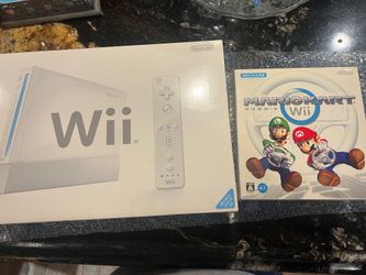 Used Wii with Wii Wheel and game.