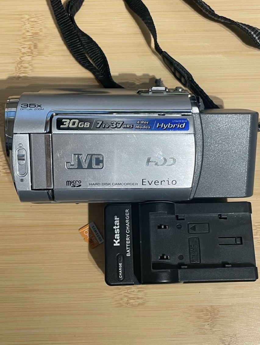 JVC everio gz-mg330hu hard disk HDD camcorder + charger , tested works  can also take photos like a digital camera