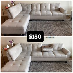 Beige sofa in good condition – minor signs of use, could use a light cleaning