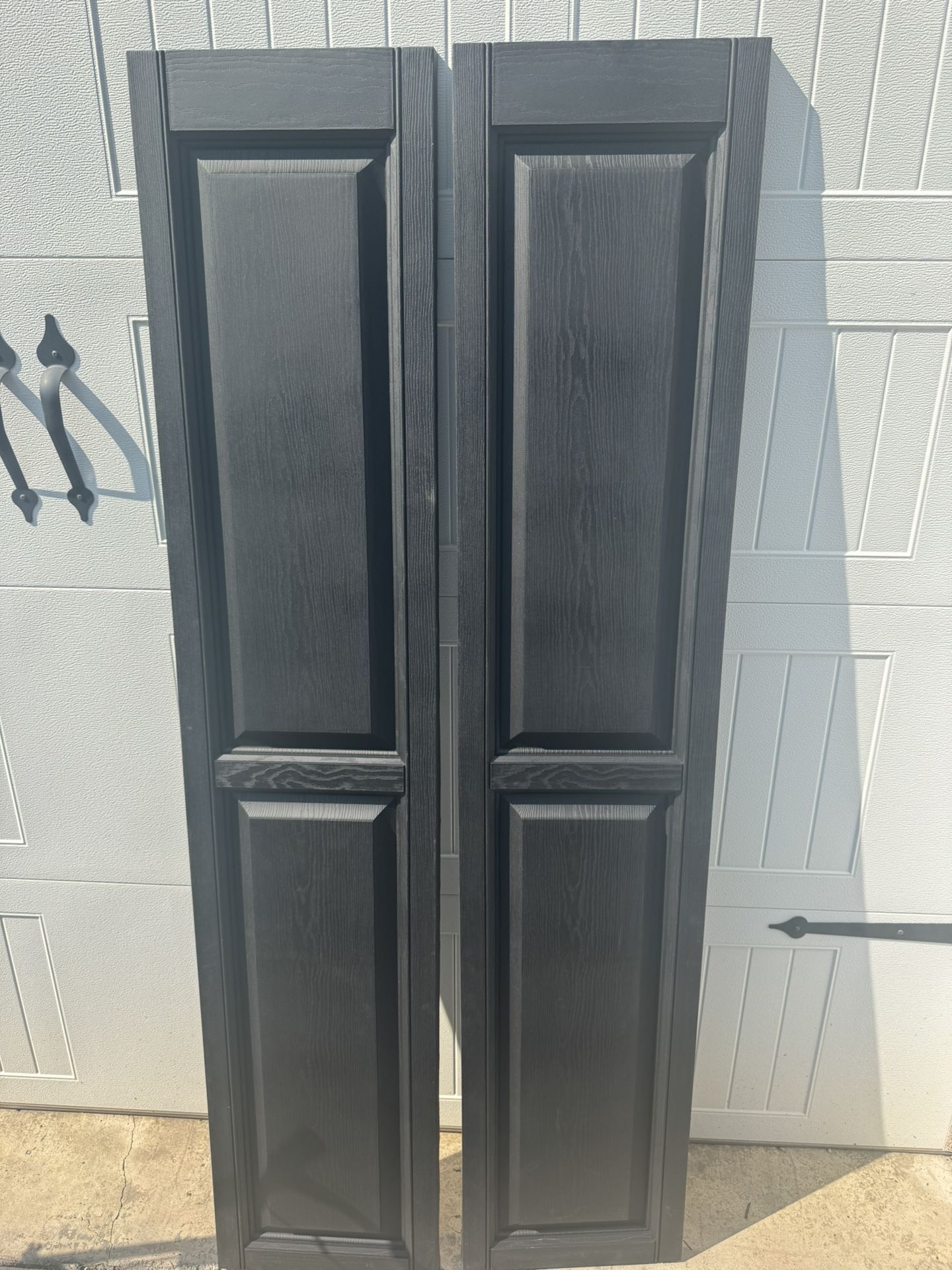2 Sets New Raised Panel Black Vinyl Shutters 15”x 71”. $20 A Set. No Hardware. Must Pickup