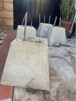 Concrete base with metal bracket