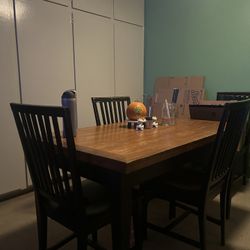Wood With Black Frame Dinner Table
