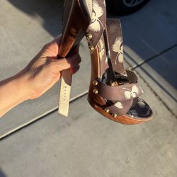 Gucci Brown Floral design with Wooden Heel and straps.