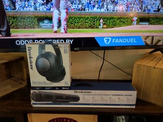 Brookstone noise. Canceling headphones wireless and powerful soundbar Bluetooth wireless