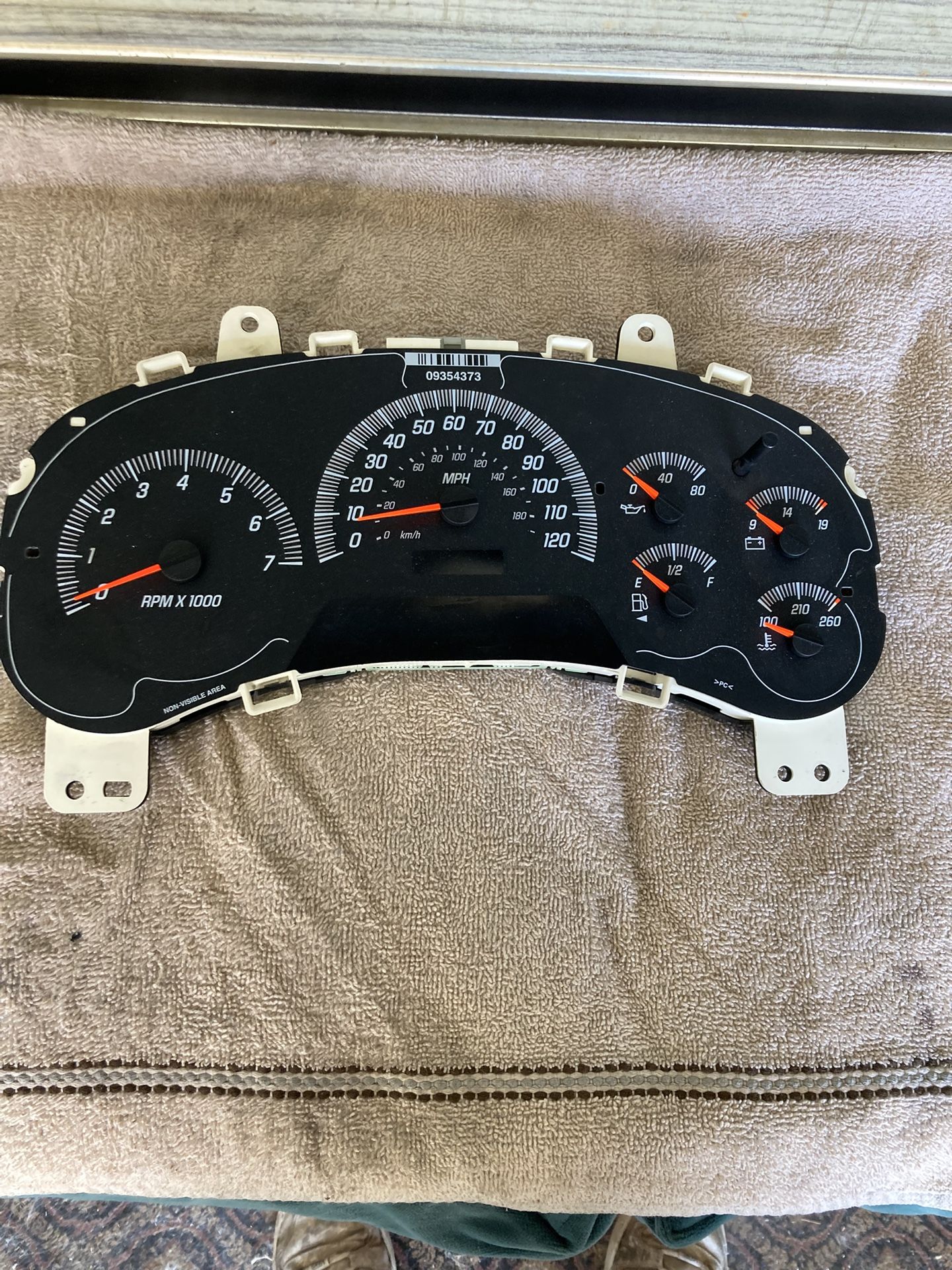 Gauge panel off a 2004 Chevy Silverado.