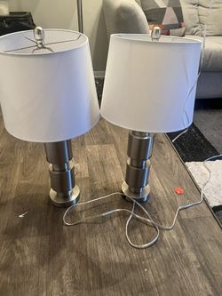 A Set Of Two Lamps And A Floor Lamp
