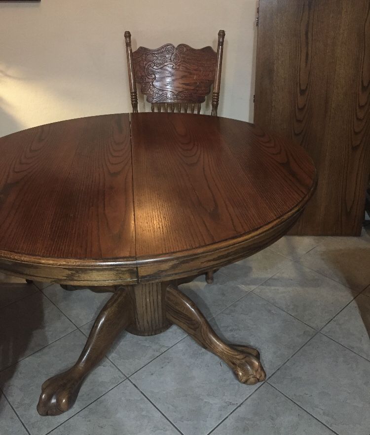 Free 48” round kitchen table with leaf and seven chairs.