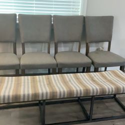 Dining room table, chairs, and bench