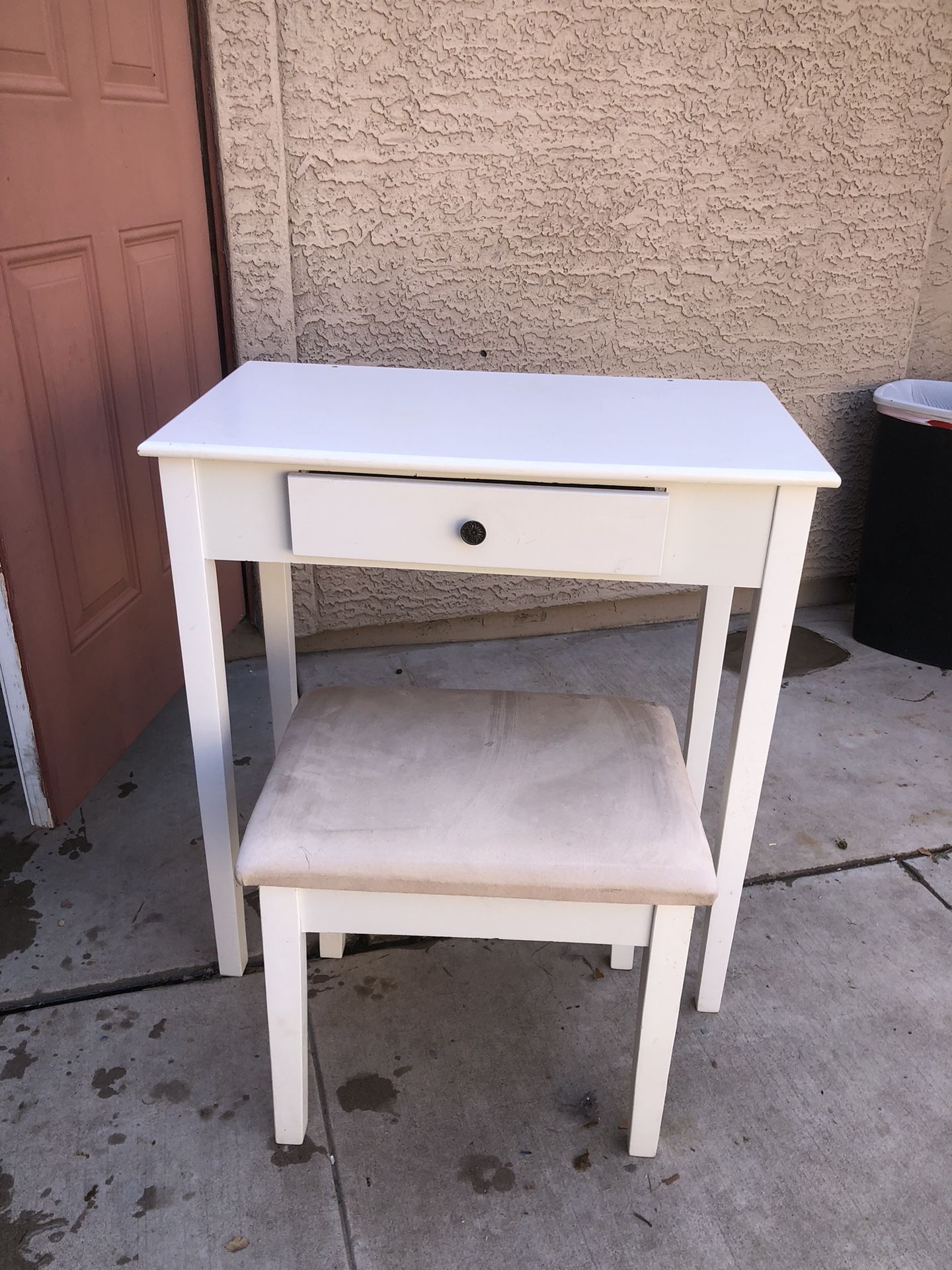 white desk with small drawer and stool