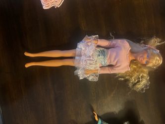 Vintage Mattel Barbie has blonde hair and blue eyes