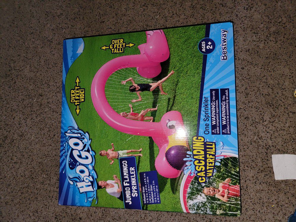 #NEW JUMBO FLAMINGO SPRINKLER. OVER 11 FT WIDE AND OVER 6 FT TALL. SEE PICTURE AND DETAILS