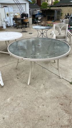 tan glass table with chairs 