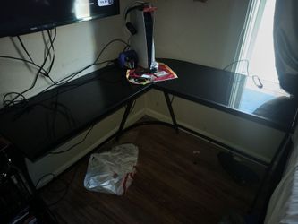 L shape black glass table