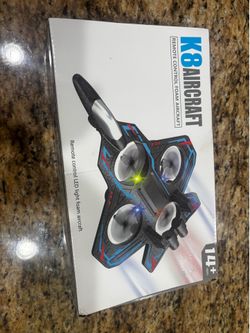Lightweight foam remote control aircraft with a black and blue color scheme
