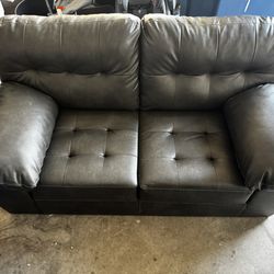Dark gray faux leather couch