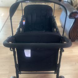 Baby stroller black. Four seater.