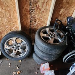 four 17-inch rims with tire