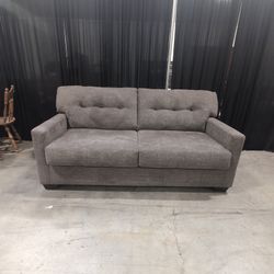 Ashley Furniture Gray Textured Polyester Two-Cushion Sofa