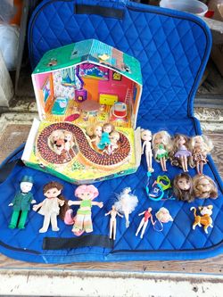 Collector dolls and 1 case