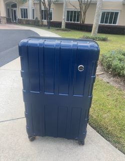 Large 31” hard shelled suitcase