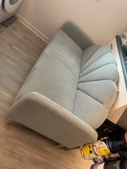 Shell back small blue/grey couch