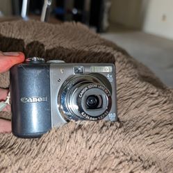 Canon Powershot A1000IS 10MP Digital Camera with 4X Optical Image Stabilized Zoom + 8GB memory sim card