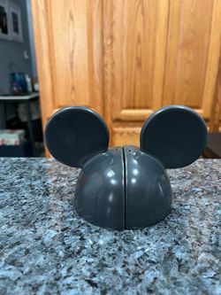 Vintage Black Mickey Mouse Ears Pair of Salt And Pepper Shakers By Treasure Craft. Size approximately 5 inches tall and 4 1/2 inches wide. Preowned