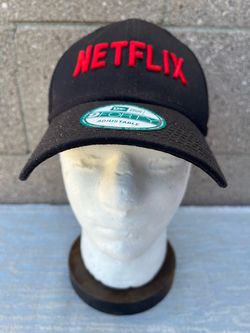 black adjustable baseball cap featuring the red Netflix logo embroidered