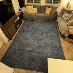 Brand NEW Blue shag rug 10 feet 6 inches by 7 feet 10 inches. Too big for me! Domino Shag Brand.