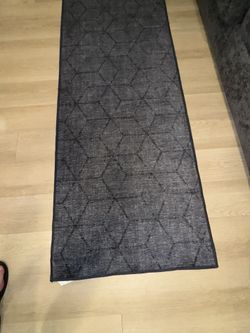 Black/Gray Ruggable Pick up only. 118”. X 29 in. Incl. Anti-slip Matt. Like new and recently washed. The rug is in excellent condition with no stains.