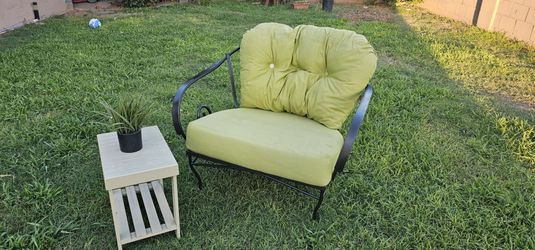 **Wrought Iron Patio Chair with Cushions and Side Table**