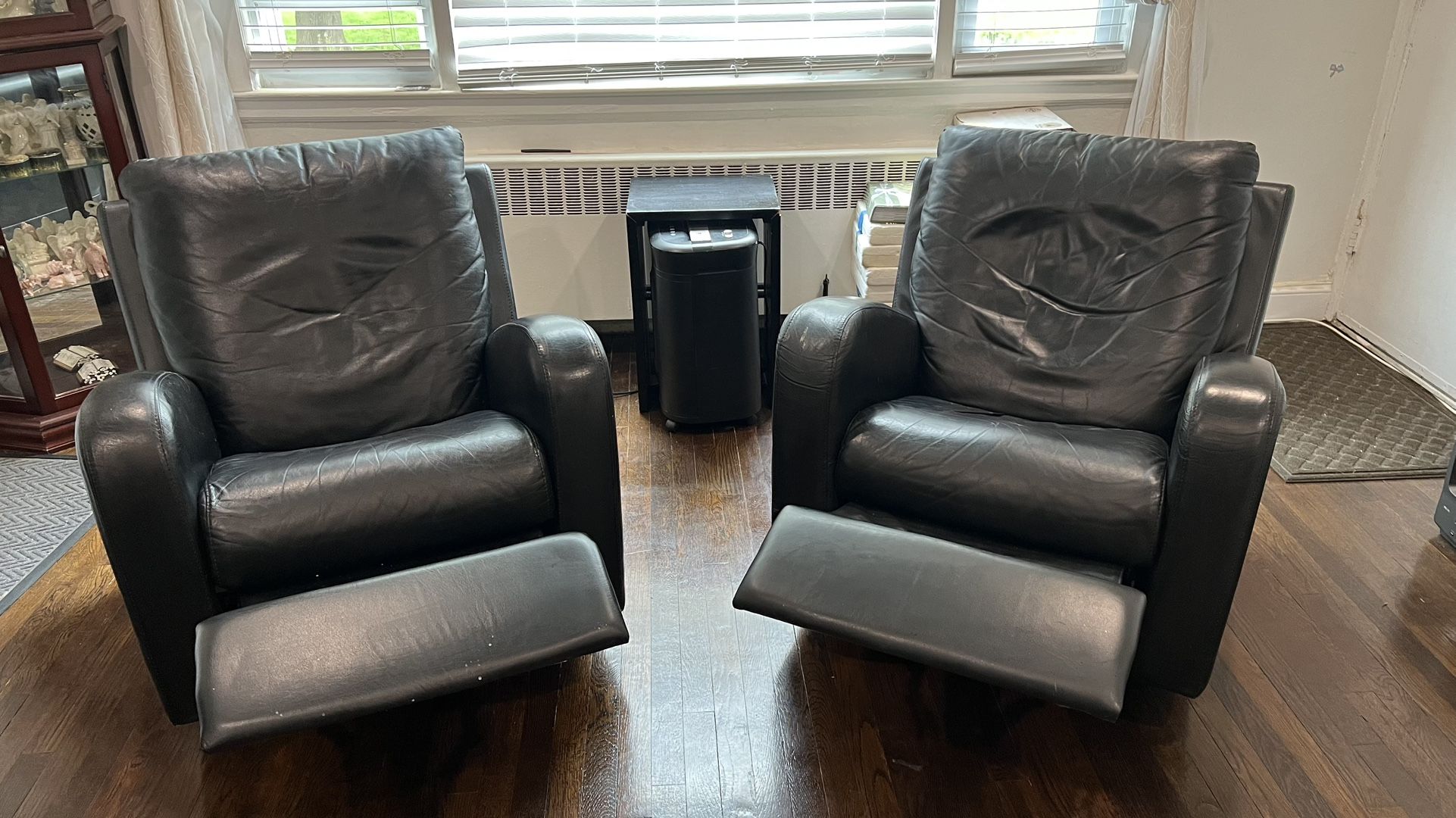 Two Leather Rocker Recliners