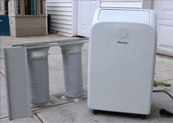Hisense AP55023HR1GD 8,000 BTU  dual-hose portable air conditioner with a built-in heat pump