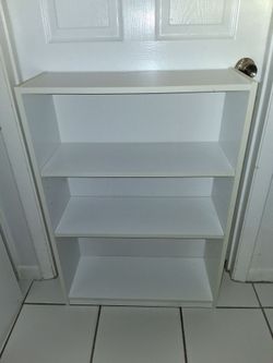white bookcase (2 available) $20 EACH FIRM