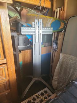 B***** rolling big screen TV stand practically new excellent for outdoor Sporting events movie night. Whatever you want to do will hold the biggest TV
