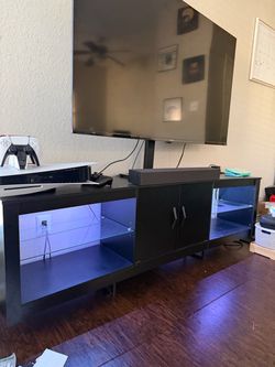 Black TV Counter with LED Lights and Cabinet
