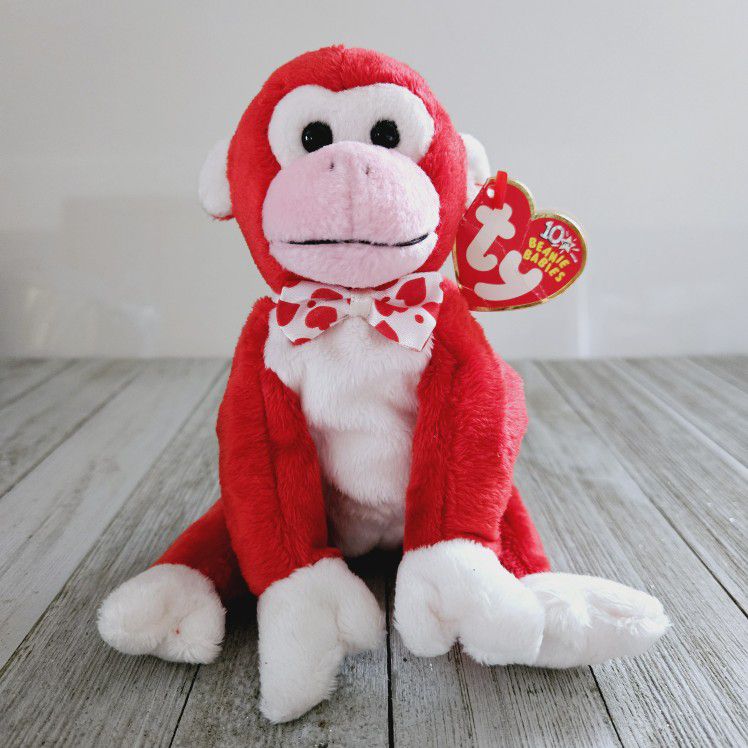 Vintage 6" Ty Valentine Born February 14, 2003 Beanie Baby Red White and Pink Plush Monkey Stuffed Animal Beanbag Toy.

Ty Valentine's tag reads: 

Pl