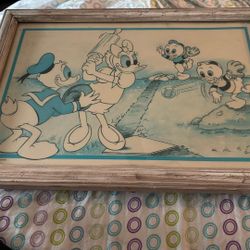 Donald And Dezie Duck Playing A Game Of Baseball With Two Of Their Nephews