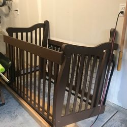 Brown Baby Crib Disassembled with Spring
