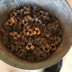 A bucket of brand new galvanized plywood clips they hold the plywood together when you’re shooting a roof
