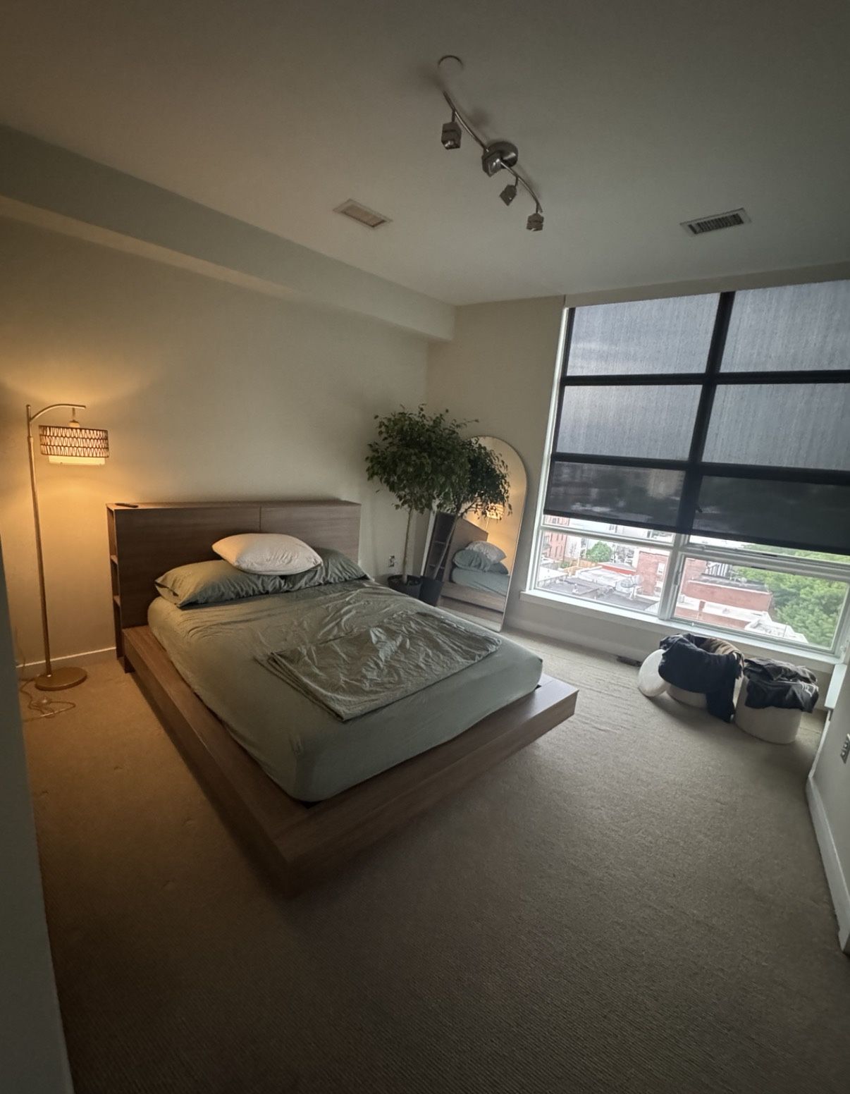 Modern queen platform bed with storage headboard and Serta Perfect Sleeper mattress.