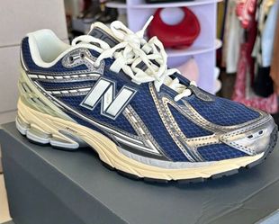 New Balance 1906R Sneakers in the Vintage indigo and dark silver metallic colorway.