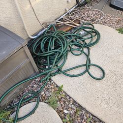 Two Green Water Hoses