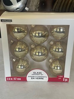 8-piece set of light gold glass Christmas ornaments by Ashland.