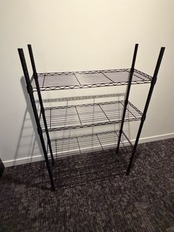 4 black rack metal shelving unit