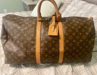 Louis Vuitton Monogram
Bandouliere 55