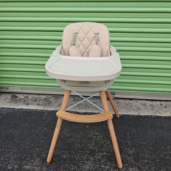 Modern beige high baby chair with wooden legs