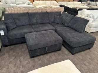 Black corduroy sectional w/ storage ottoman