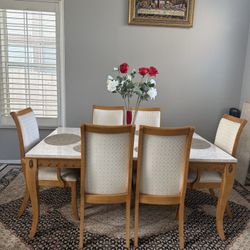 Dining Table And Two Extinction Pieces With 6 Chairs And Decorations 