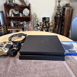 Sony PS4 Slim 1TB With 1 Game And 1 Controller and hdmi cable- Black. Model CUH-2215B. Tested. Working great. 
